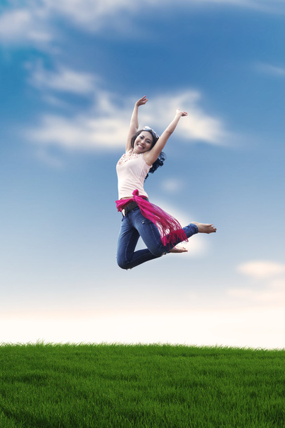 Excited Asian woman jumping - Photo, Image