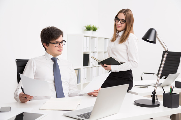 Businessman and businesswoman in office - Photo, Image
