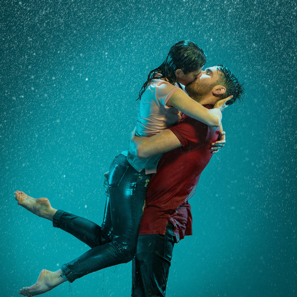 The loving couple in the rain - Photo, image