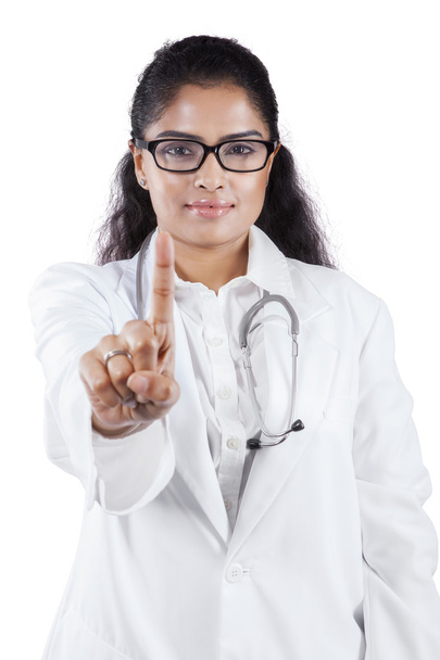 Female doctor pressing imaginary button - Фото, изображение