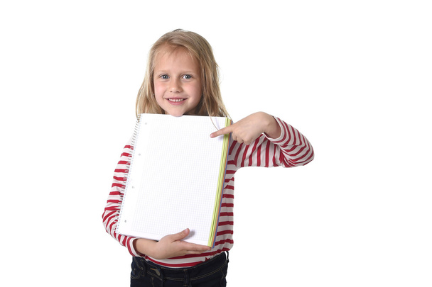sweet beautiful female child 6 to 8 years old  holding notebook  - Photo, image