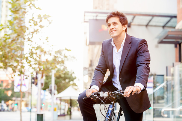 Successful businessman with bicycle - Photo, image