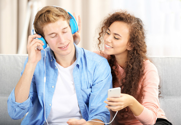 Teenager couple listening to music - 写真・画像