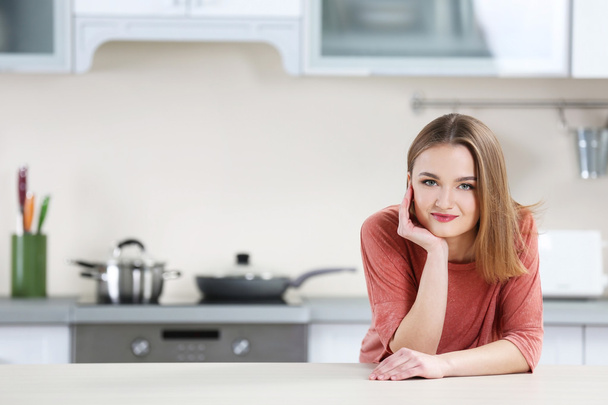 Young woman in the kitchen - Fotó, kép
