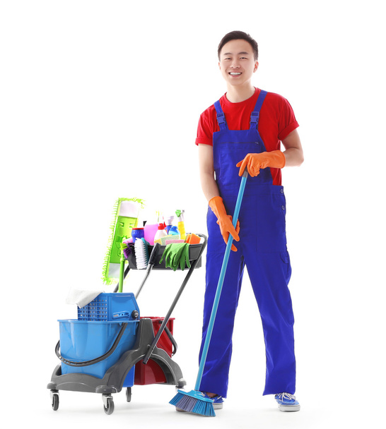 Young smiling male cleaner isolated on white - Photo, image