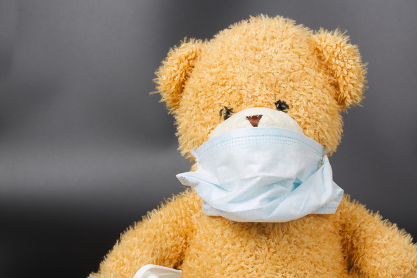 A plush teddy bear in a medical mask - Photo, Image