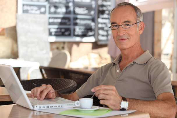 Grey-haired man in coffee shop - Фото, изображение
