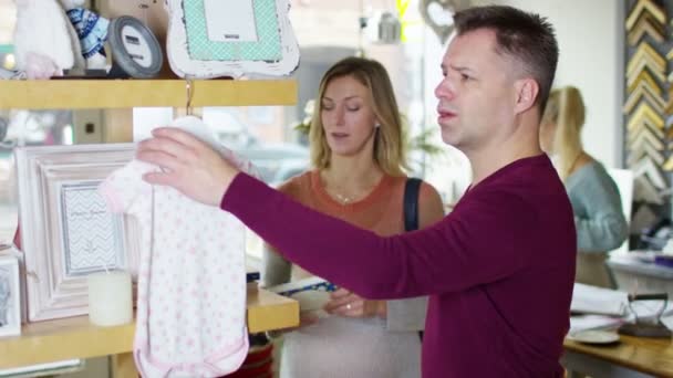 couple buying baby clothes - Footage, Video