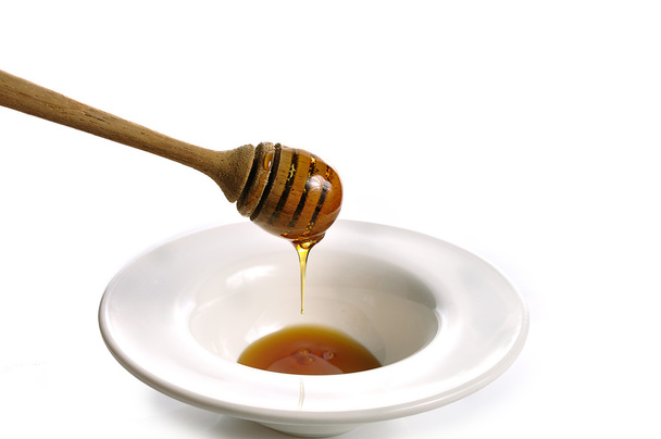 Honing geïsoleerd op witte achtergrond - Foto, afbeelding