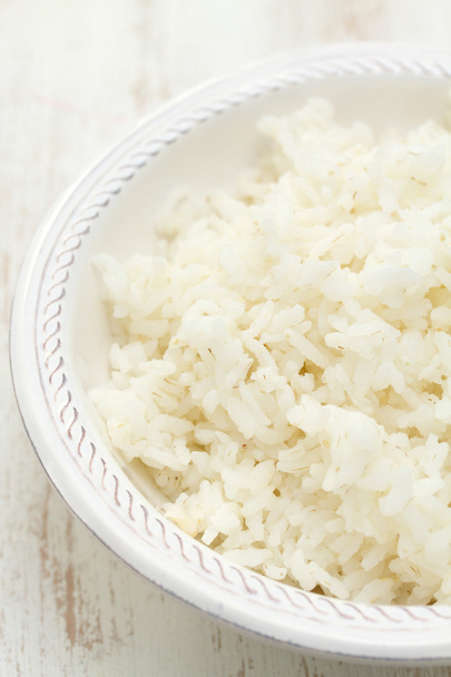 boiled rice on white bowl on white background - Fotografie, Obrázek