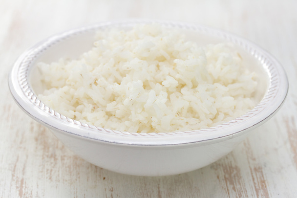 boiled rice on white bowl on white background - Fotografie, Obrázek