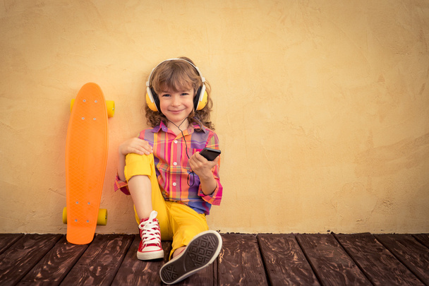 Hipster child with skateboard - Foto, imagen