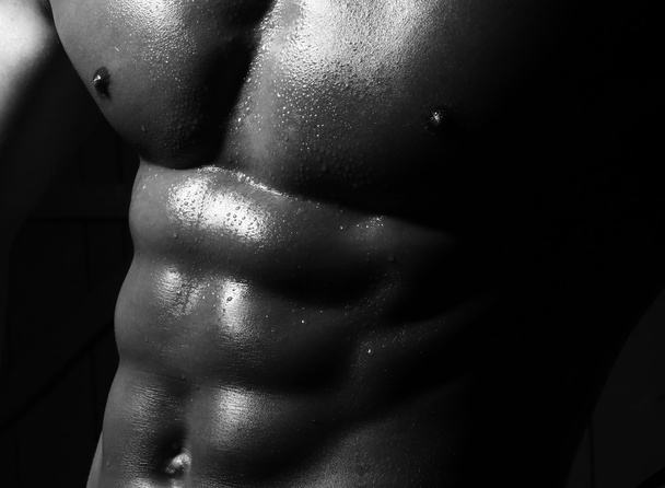 Closeup of male sporting belly - 写真・画像