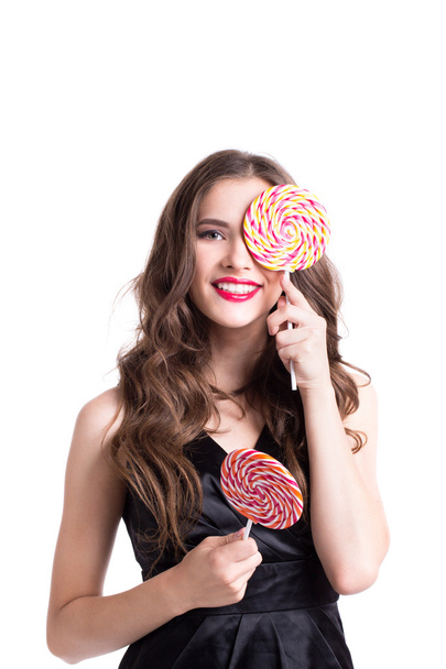 Beautiful woman with a candy.  - Zdjęcie, obraz