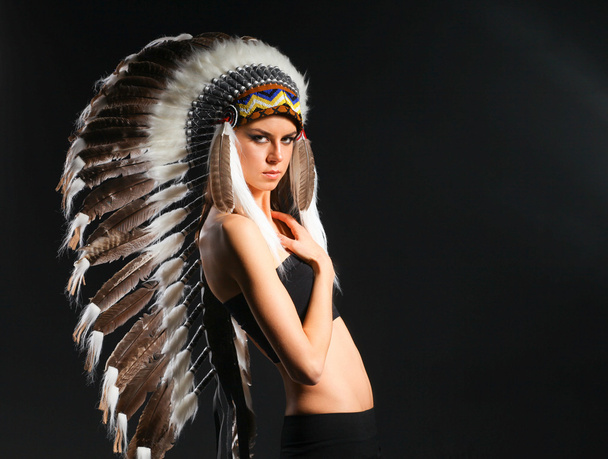 Beautiful woman in native american costume with feathers - Φωτογραφία, εικόνα