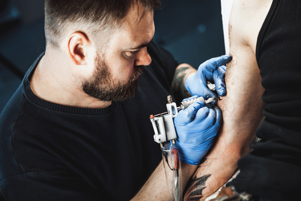 master tattoo artist with a beard - Photo, Image