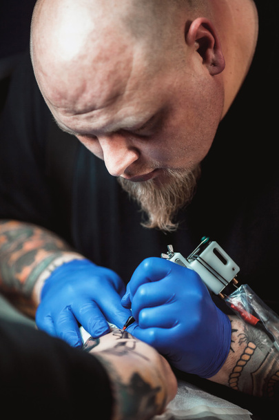 master tattoo artist - Фото, изображение