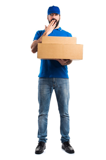 Delivery man doing surprise gesture - Photo, Image