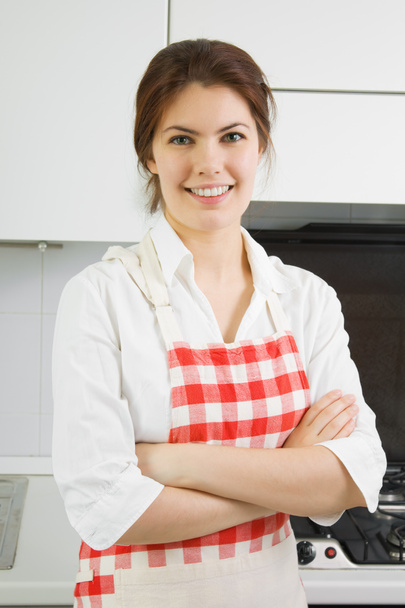 Portrait of a woman in the kitchen - Φωτογραφία, εικόνα