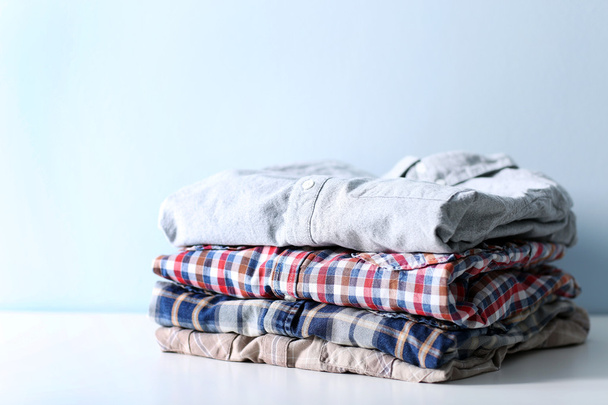 Male clothes on table - 写真・画像