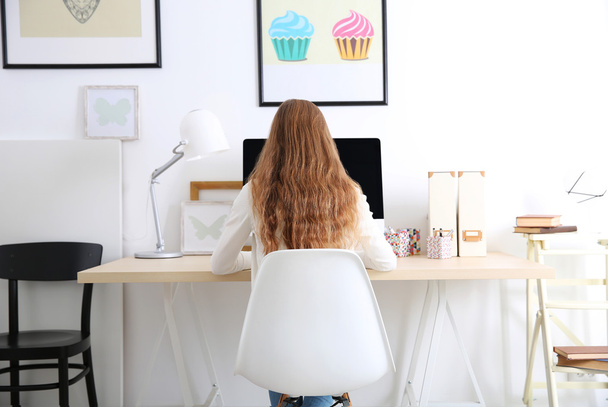 Woman working with computer at home or at office - Photo, image