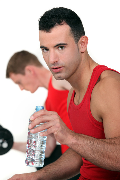 Athletic man with bottle of water - Foto, Imagem