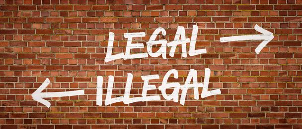 Legale of illegale geschreven op een bakstenen muur - Foto, afbeelding