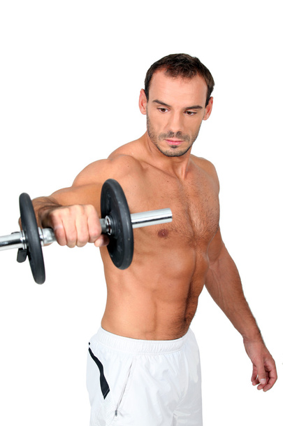Man lifting a dumbbell - Foto, afbeelding