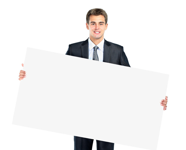 Felice sorridente giovane uomo d'affari mostrando cartello bianco
 - Foto, immagini