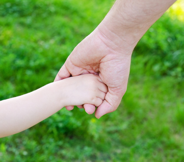 Child holds the hand of father - Photo, Image