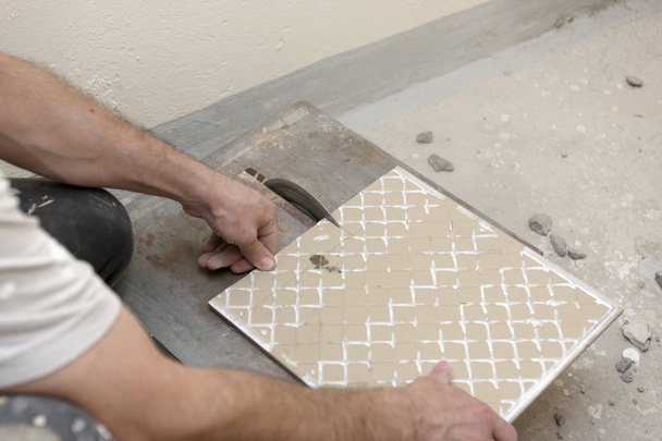 Cutting Floor Tiles - 写真・画像