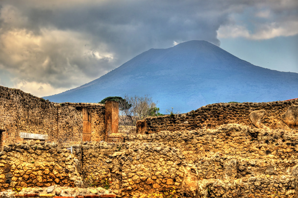 Ruins of Pompeii with Mount Vesuvius in the background - Photo, Image