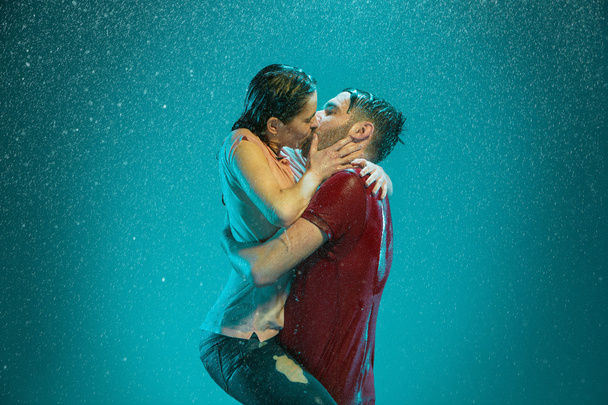 The loving couple in the rain - Photo, image