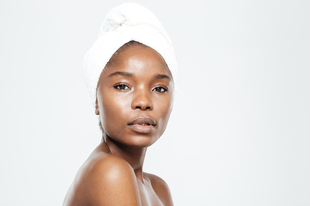 Beautiful afro american woman with towel on head - Photo, image