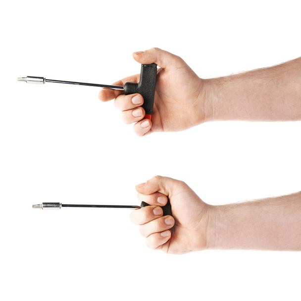 Set of hand holding a T-shape screwdriver tool, composition isolated over the white background - Fotografie, Obrázek