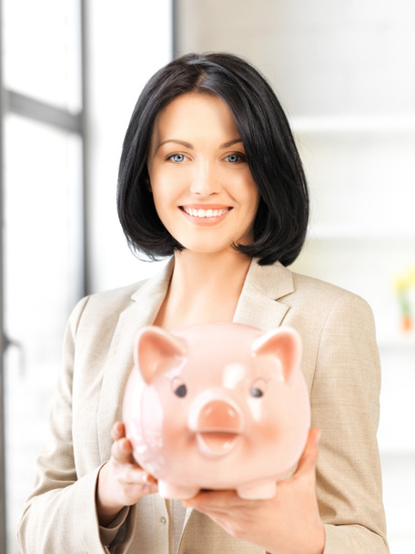 Lovely woman with piggy bank - Fotografie, Obrázek