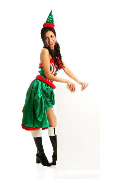 Woman in elf clothes holding empty banner - Foto, Imagen