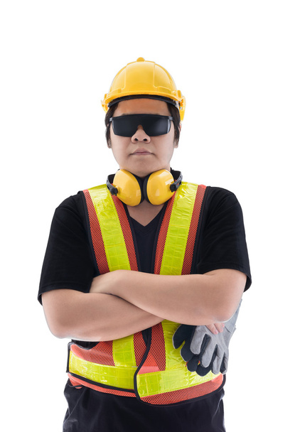 miespuolinen rakennustyöntekijä, jolla on standardi rakennusturvalaite
 - Valokuva, kuva