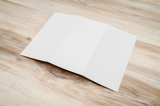 Trifold white template paper on wood textur - Foto, imagen