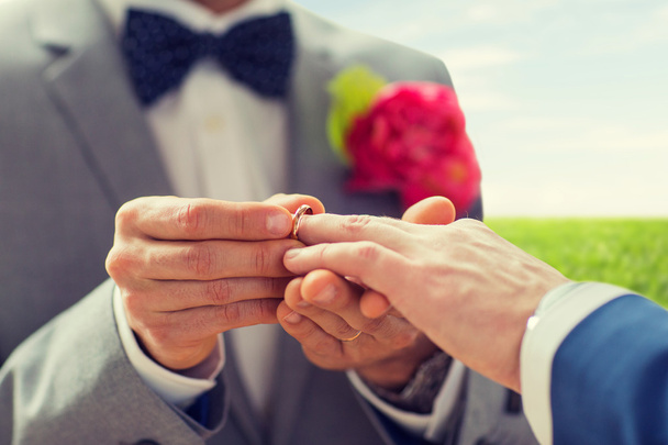 close up of male gay couple hands and wedding ring - Zdjęcie, obraz