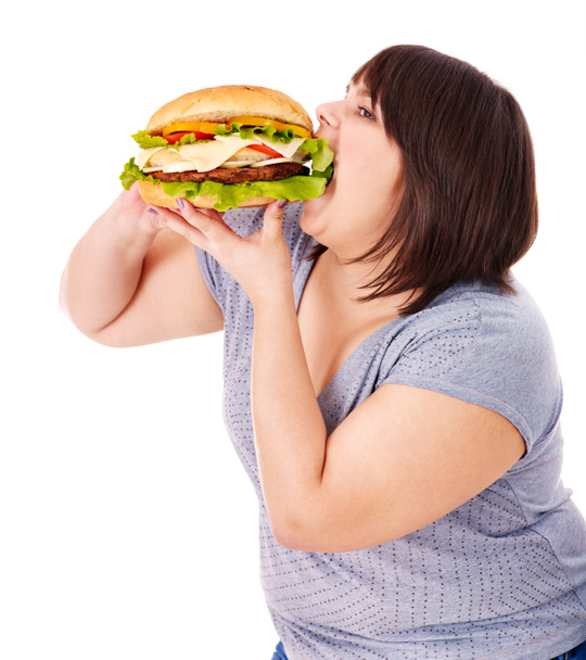 Mujer comiendo hamburguesa
. - Foto, imagen