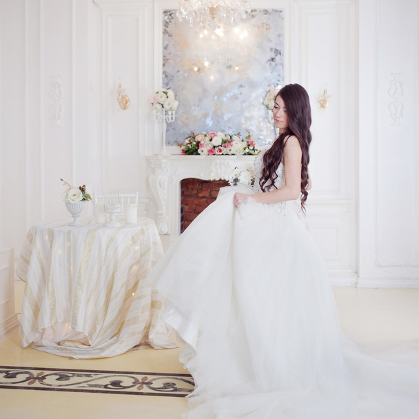 Portrait of beautiful bride. Wedding decoration. Luxurious light interior - 写真・画像
