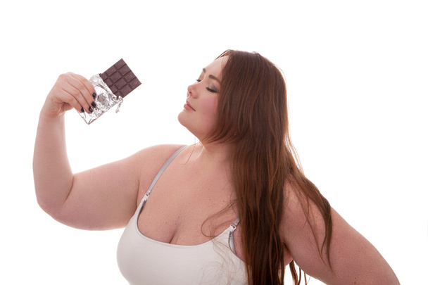 Fat woman with chocolate on her hands isolated on white background - Photo, image