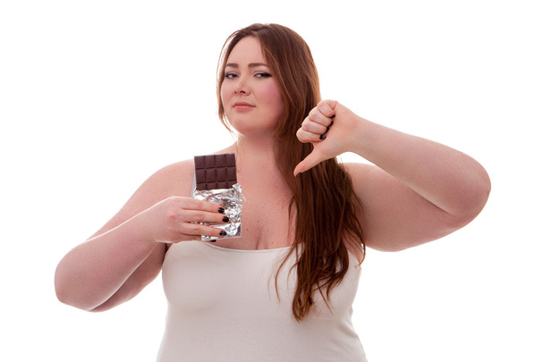 Fat woman with chocolate on her hands isolated on white background - Foto, afbeelding