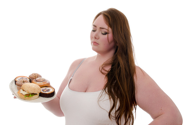 the fat woman with cakes and burgers on a platter in her hands isolated on white background - Valokuva, kuva