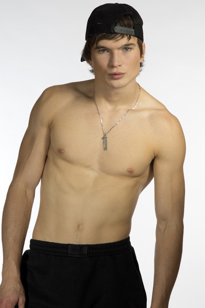 Naked waist young athlete with sporty cap - Zdjęcie, obraz