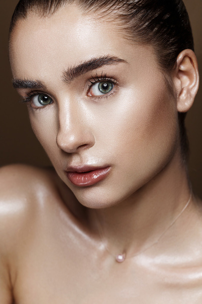 Strobing or Highlighting makeup. Closeup portrait of beautiful g - Fotó, kép