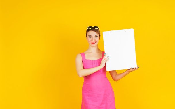 Young woman on yellow background - Foto, immagini