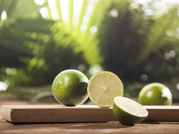 Fresh limes on wooden background - Foto, Imagen