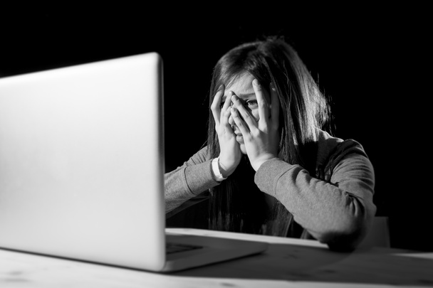teenager girl suffering cyberbullying scared and depressed exposed to cyber bullying and internet harassment - Photo, Image
